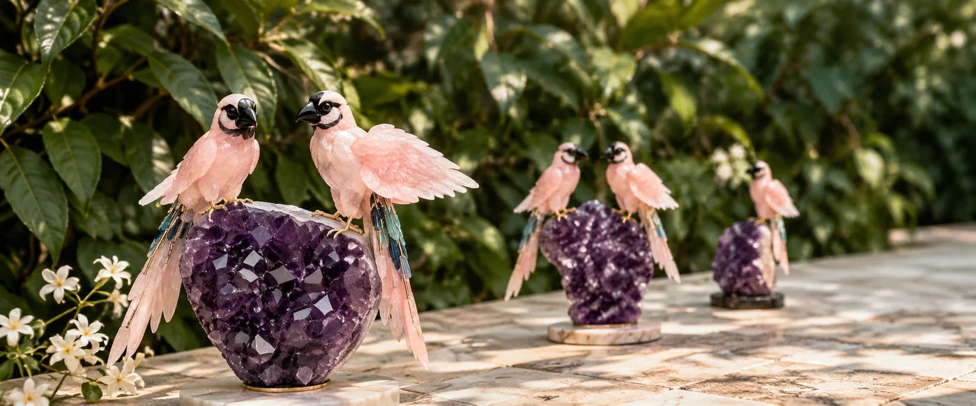 Rose quartz birds on amethyst geodes, set along a sunlit stone terrace against dense planting