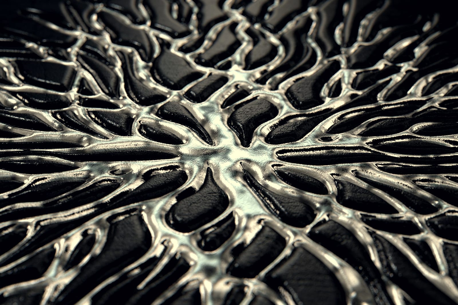 A polished metal surface in macro, its lattice catching raking light.